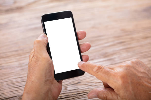 istock Senior Man Holding Mobile Phone 1042652450