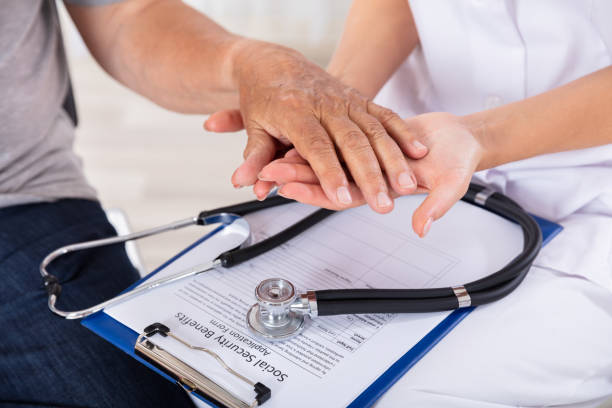 istock Doctor Holding Senior Patient's Hand 1042652510