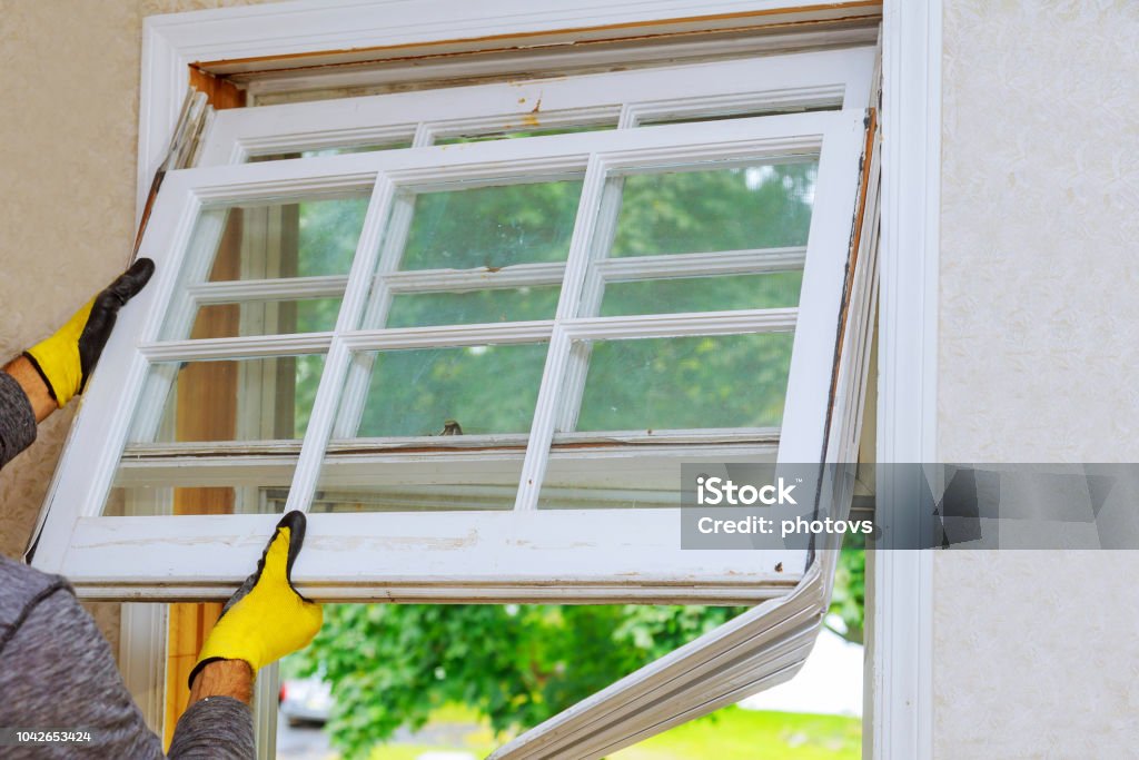 renovation work in an old house and replacing windows renovation work in an old house and replacing windows, building energy efficiency Window Stock Photo