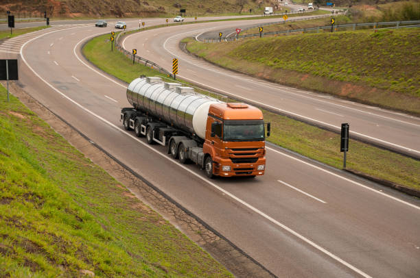 Brand new golden truck on lightly wet winding road