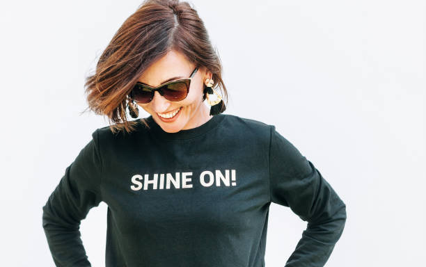 istock Attractive free feeling smiling woman in black sweatshirt 1042684988
