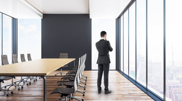 istock Thoughtful businessman in boardroom 1042688180