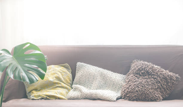 istock interior design with a sofa and a variety of pillows 1042695436