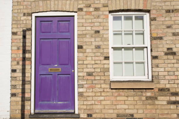 violet pastel vintage front door on a restored brick wall of a georgian house residential building with white wooden sash window - london england sash window house georgian style imagens e fotografias de stock