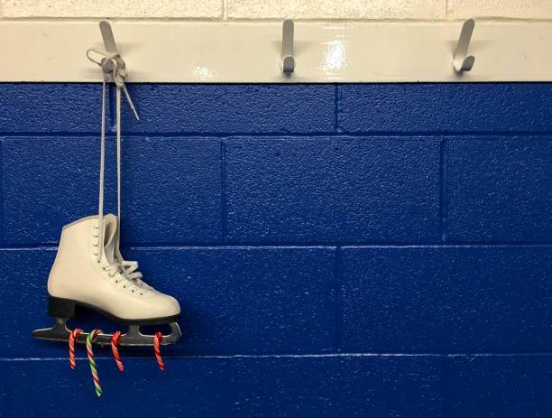 istock Hanging figure skate with candy canes. Christmas 1042700268