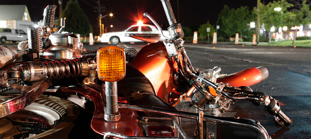 View from the rear of a wrecked motorcycle looking towards an out of focus police vehicle.More of my car accident photos.