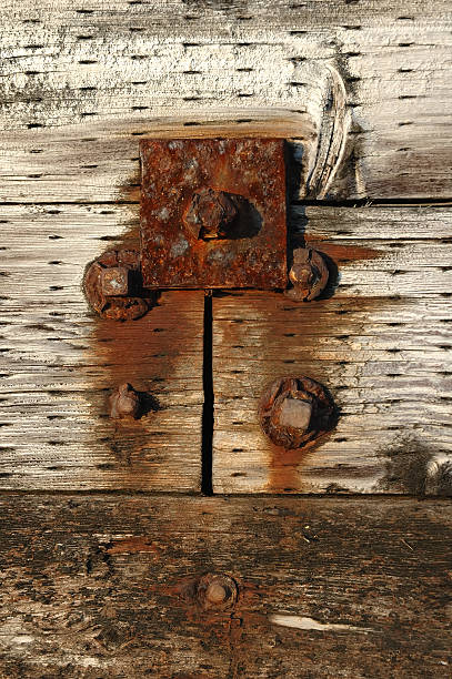 istock rusty bolts in wood 104271544