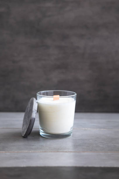istock Concrete scented soy round candle on grey table 1042715748