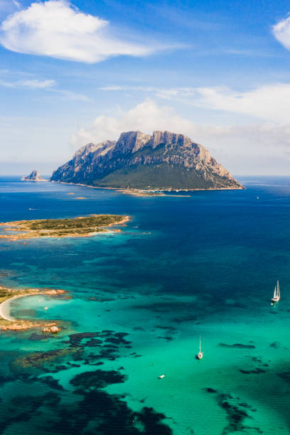 Spectacular aerial view of Tavolara's island bathed by a clear and turquoise sea, Sardinia, Italy. Spectacular aerial view of Tavolara's island bathed by a clear and turquoise sea, Sardinia, Italy. sardinia stock pictures, royalty-free photos & images