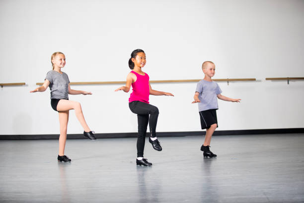 Children Practicing Tap Dancing A group of children at tap dancing practice tapping stock pictures, royalty-free photos & images