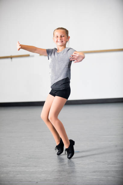 istock Little Girl Practicing Tap Dancing 1042716518