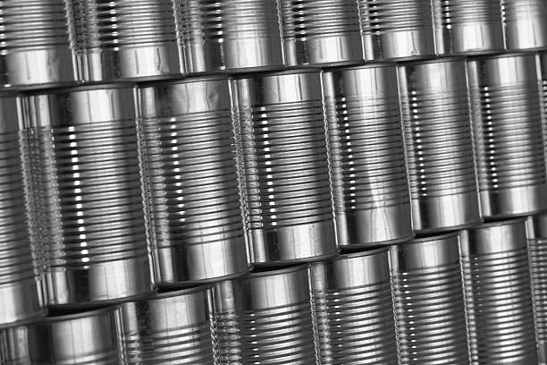 istock tinned food: generic steel cans / tins stacked in rows 104271844
