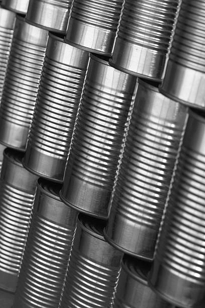 istock tinned food: generic steel cans / tins stacked in rows 104271846