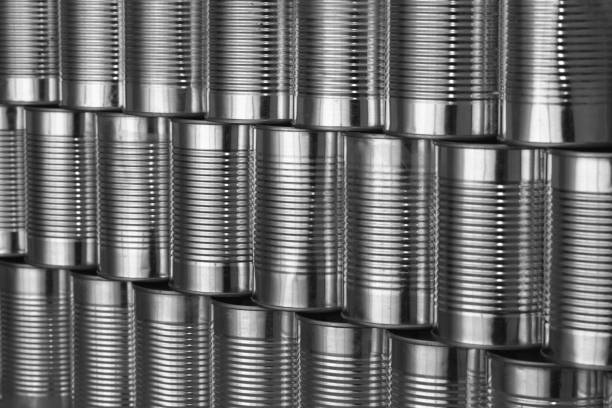 istock tinned food: generic steel cans / tins stacked in rows 104271848
