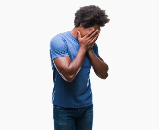 istock Afro american man over isolated background with sad expression covering face with hands while crying. Depression concept. 1042723860