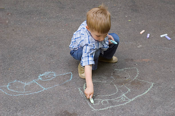 istock child drawing on asphalt car 104272499