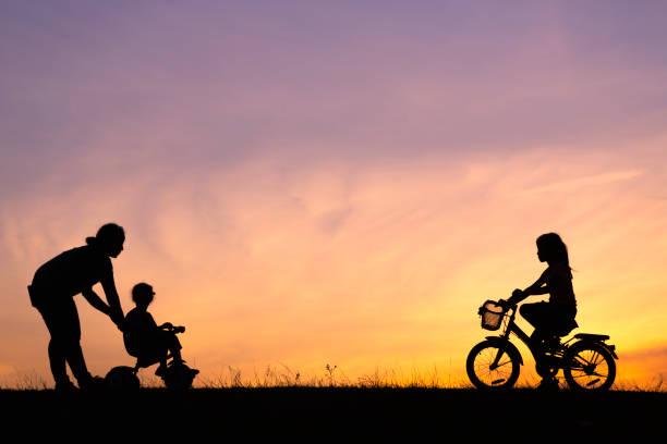 istock mother and her daughter riding bicycle 1042727694