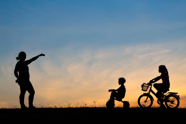 istock mother and her daughter riding bicycle 1042727772