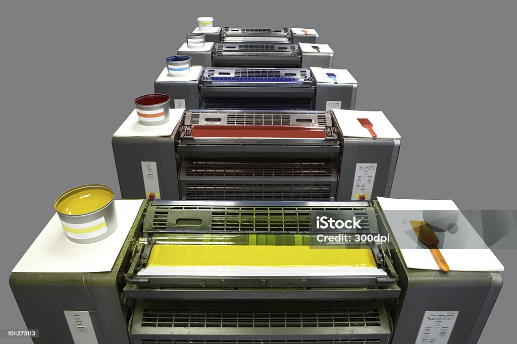 Five colour printing press Printing Press Ink Units showing  4 colours and varnish. Isolated On Grey Clipping Paths Ink Stock Photo