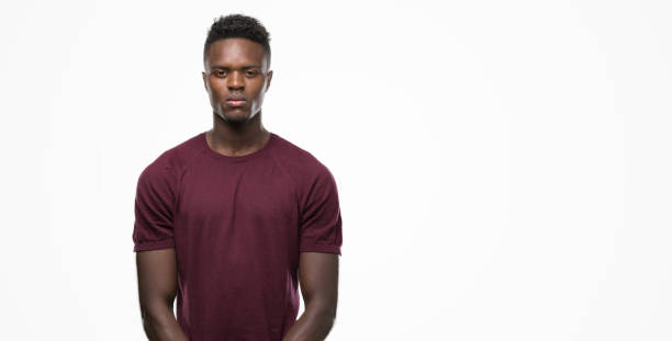 istock Young african american man with a confident expression on smart face thinking serious 1042734728