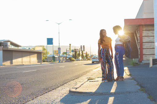 Students On Urban American Street at Sunset Involving Young College Age Ethnic Females with various angles, DOF and POV Lens Flare and Backlight Intentional(photos professionally retouched and filters applied as needed - Lightroom / Photoshop - original size 8688 x 5792 canon 5DS Full Frame)