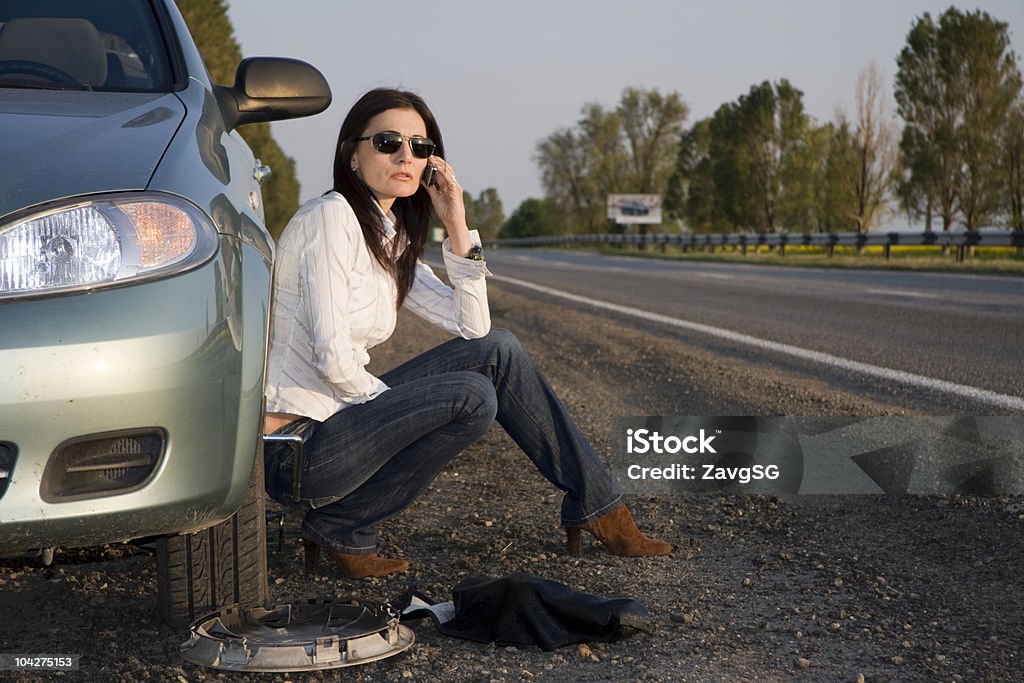 Woman calling for help from the road  Flat - Physical Description Stock Photo