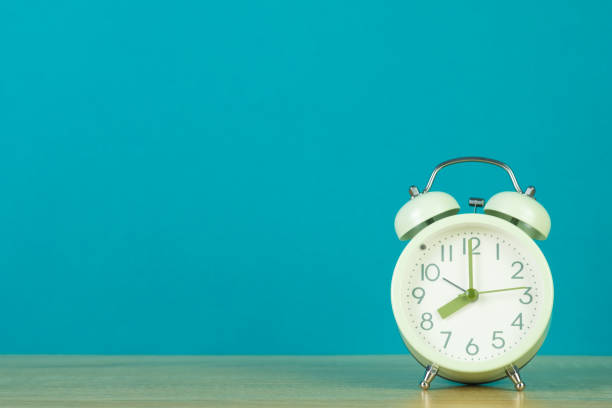 istock Retro vintage alarm clock on wood table, time concept. 1042756724