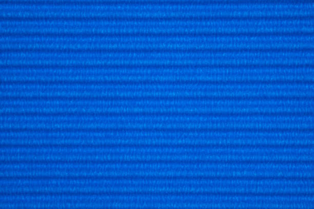 istock Blue corrugated paper texture, use for background. vivid colour with empty space for add text or object. 1042756744