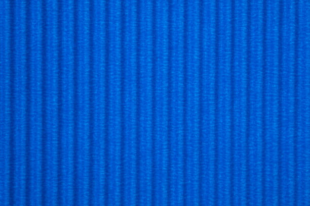 istock Blue corrugated paper texture, use for background. vivid colour with empty space for add text or object. 1042756748