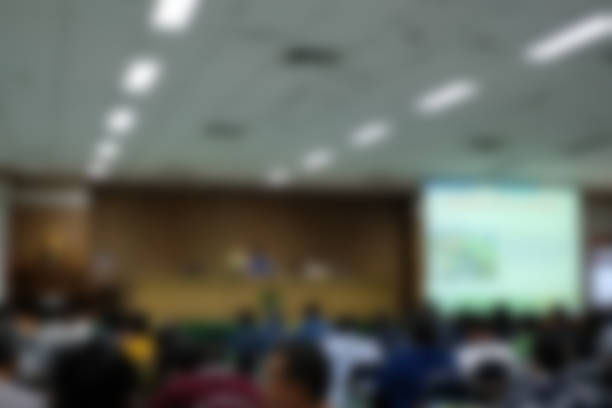 istock stage & presentation screen in seminar conference room. blurry background 1042757258