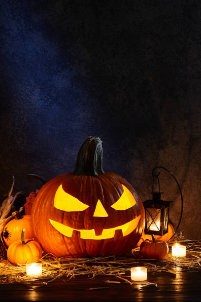 istock Halloween pumpkin jack lantern in dark barn, holiday concept 1042759838