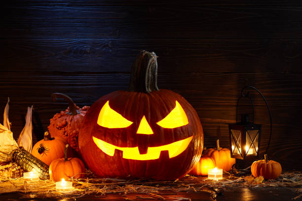 istock Halloween pumpkin jack lantern in dark barn, holiday concept 1042759880