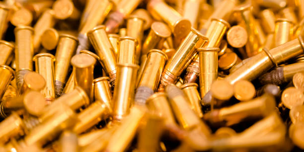 istock Cylindrical golden bullets in a pile 1042765876