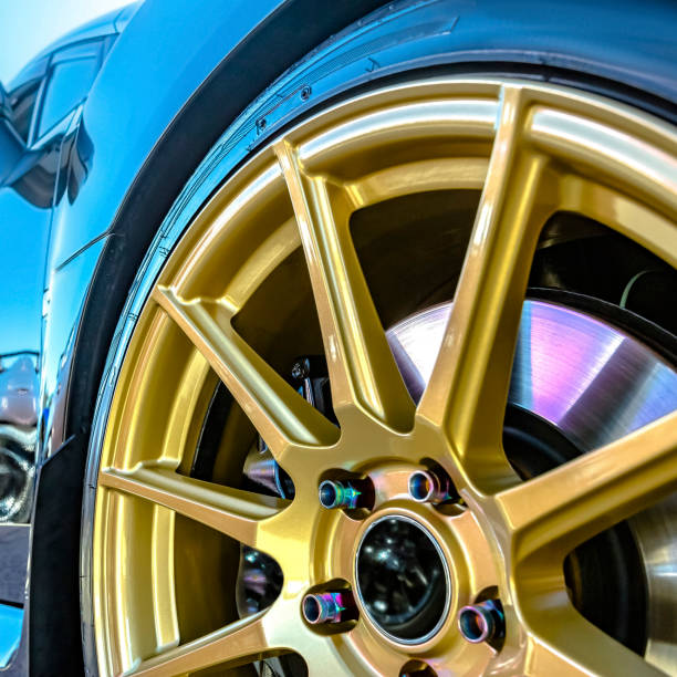 istock Golden rim with brake pad showing between spokes 1042765936