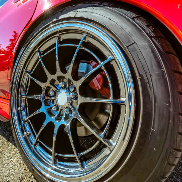 istock Red car with silver rim on its wheels 1042765986