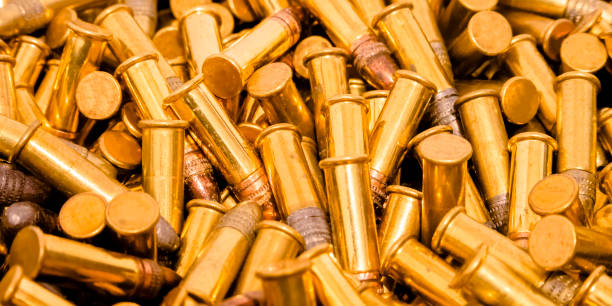 istock Shiny gold plated ammunition with silver head 1042766060