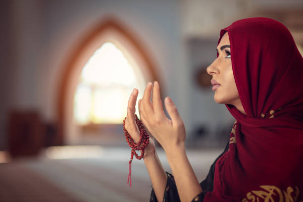 istock Young praying woman falling on knees in mosque 1042775916