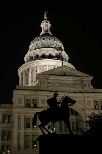 Texas Capitol with Ranger Statue (centered) at night