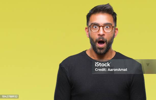Adult Hispanic Man Wearing Glasses Over Isolated Background Afraid And Shocked With Surprise Expression Fear And Excited Face Stock Photo - Download Image Now