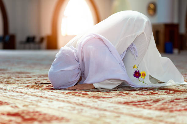 istock Young praying woman falling on knees in mosque 1042790232