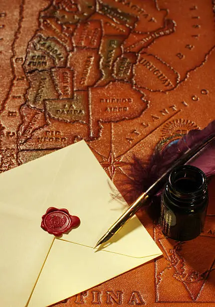 Photo of Letter, quill, inkwell & map