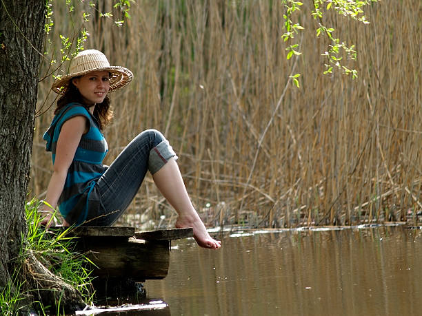 istock Girl resting near lake 104279824