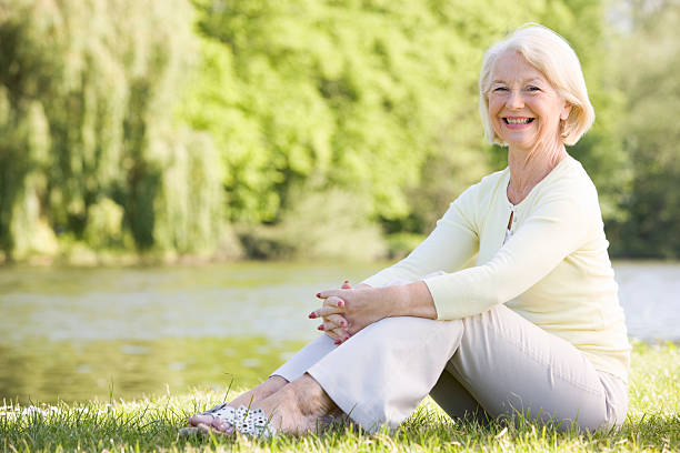 istock Woman outdoors by lake smiling 104279852