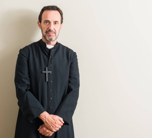 istock Senior priest religion man with a confident expression on smart face thinking serious 1042799714