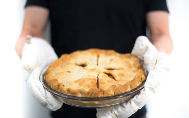 istock Man Holding Fresh Homemade Apple Pie, Close-Up 1042805144