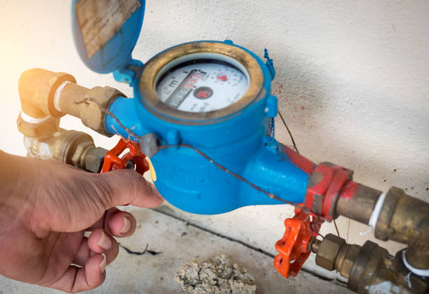 istock Hand opening water valve by turning handle 1042808858