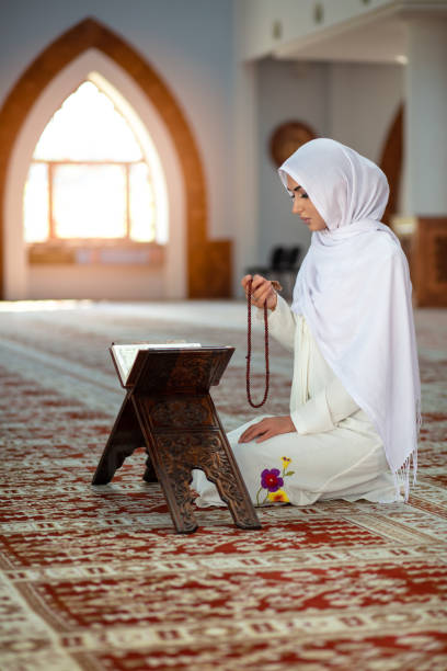 istock Crop Muslim woman with string of beads 1042808884
