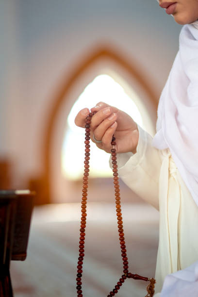 istock Crop Muslim woman with string of beads 1042811170