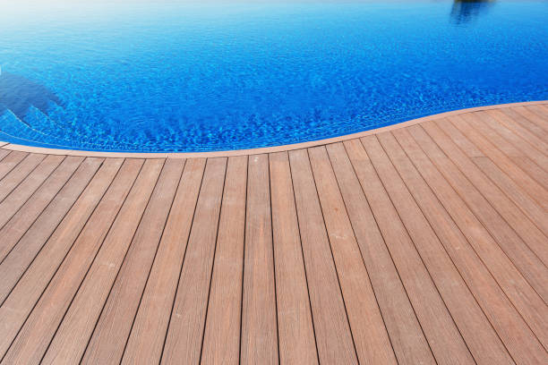 istock Wood Floor Beside Swimming Pool 1042811264