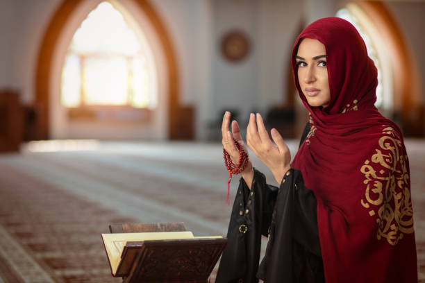 istock Young praying woman falling on knees in mosque 1042811562